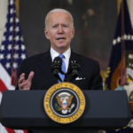 Biden speaks at podium - presidential seal