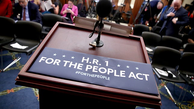 H.R. 1 - sign on podium
