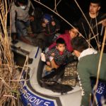 Roma, Texas, March 28 - immigrants arrive via raft from Mexico