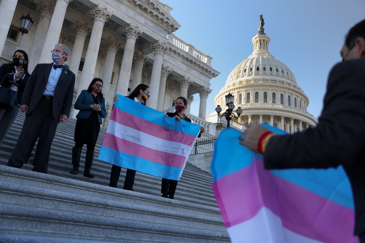 politicians on Capital steps - transgender flag