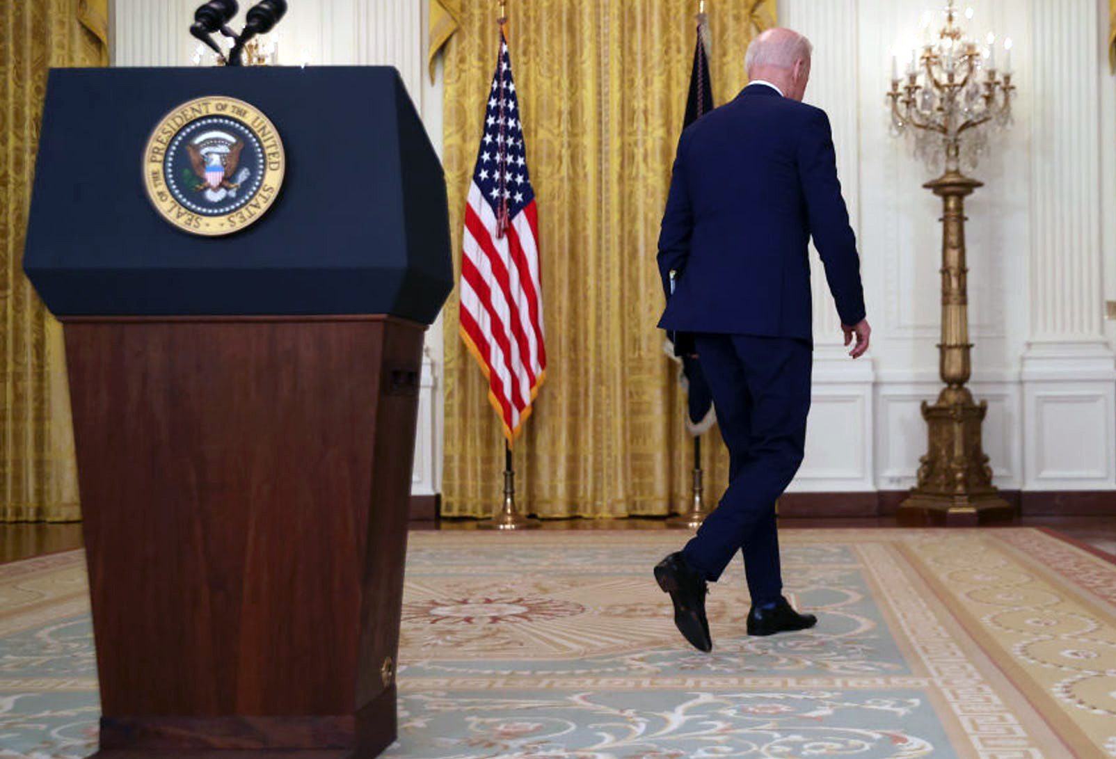 Biden walks away from lectern