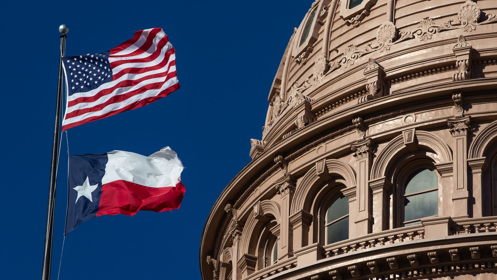 Texas Capitol US & TX flags