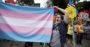protester waving transgender flag