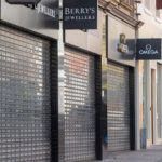 Closed businesses - nearly empty sidewalk