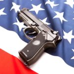 Handgun-gun-rights-pistol-weapon-armed-mass-shooting-shoot-crime-violence-US-flag-America