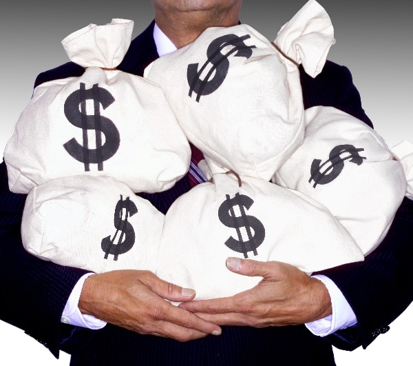 man holding bags of money