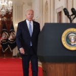 Biden walks to lectern in State Dining Room