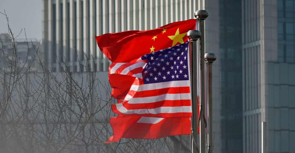 Chinese flag above USA American Flag