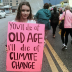 Girl w sign - old-age-climate-change