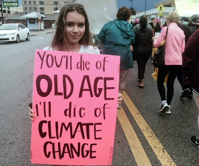 Girl w sign - old-age-climate-change