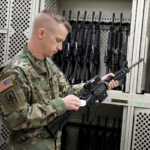 Army Paratrooper readies weapons