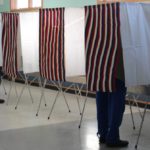 voting booths with red, white, & blue curtains