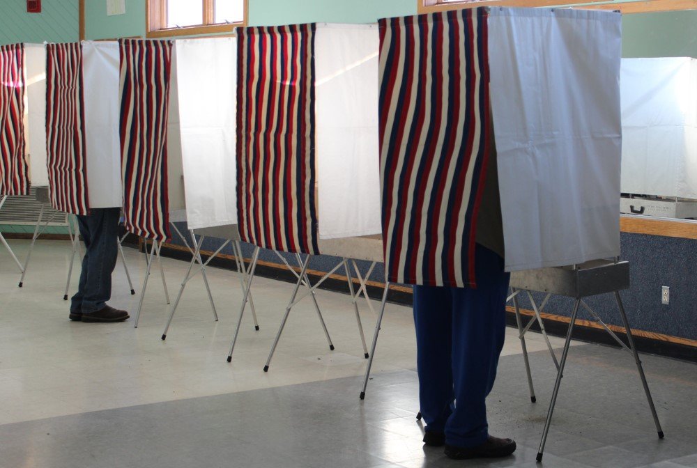 voting booths with red, white, & blue curtains