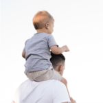 Dad with son on shoulders