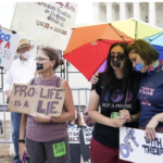 Pro-abortion protesters rainbow umbrella