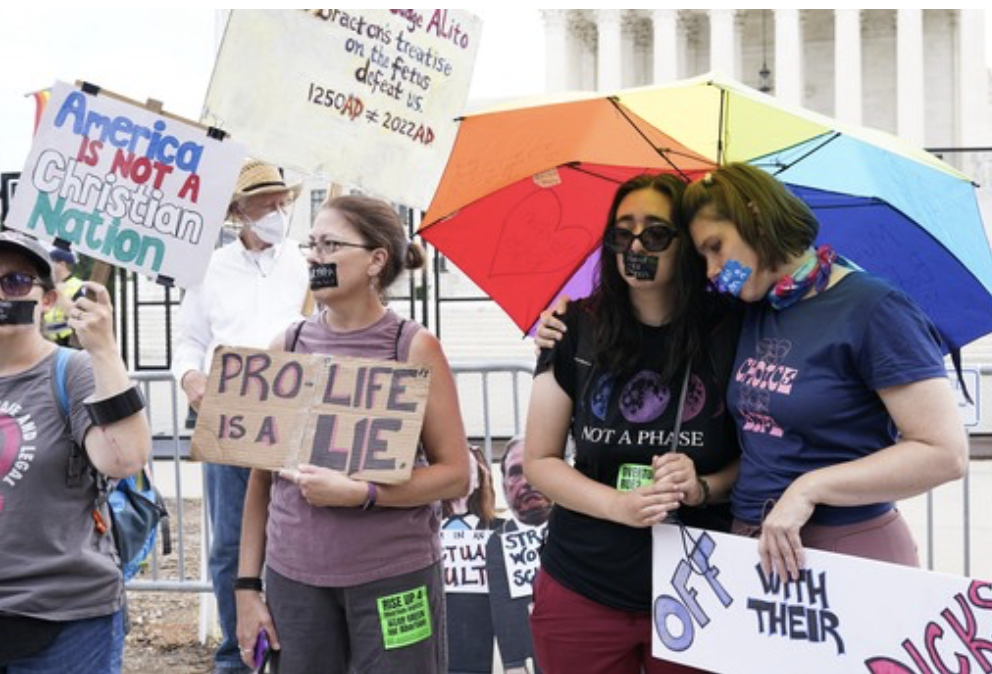 Pro-abortion protesters rainbow umbrella