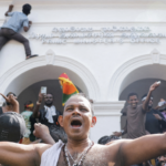 Demonstrators celebrate after the fall of Sri Lanka's govt.