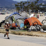 Jogger runs past homeless tents