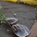 US-Flag-on-mirrored-sunglasses-crime-scene-tape