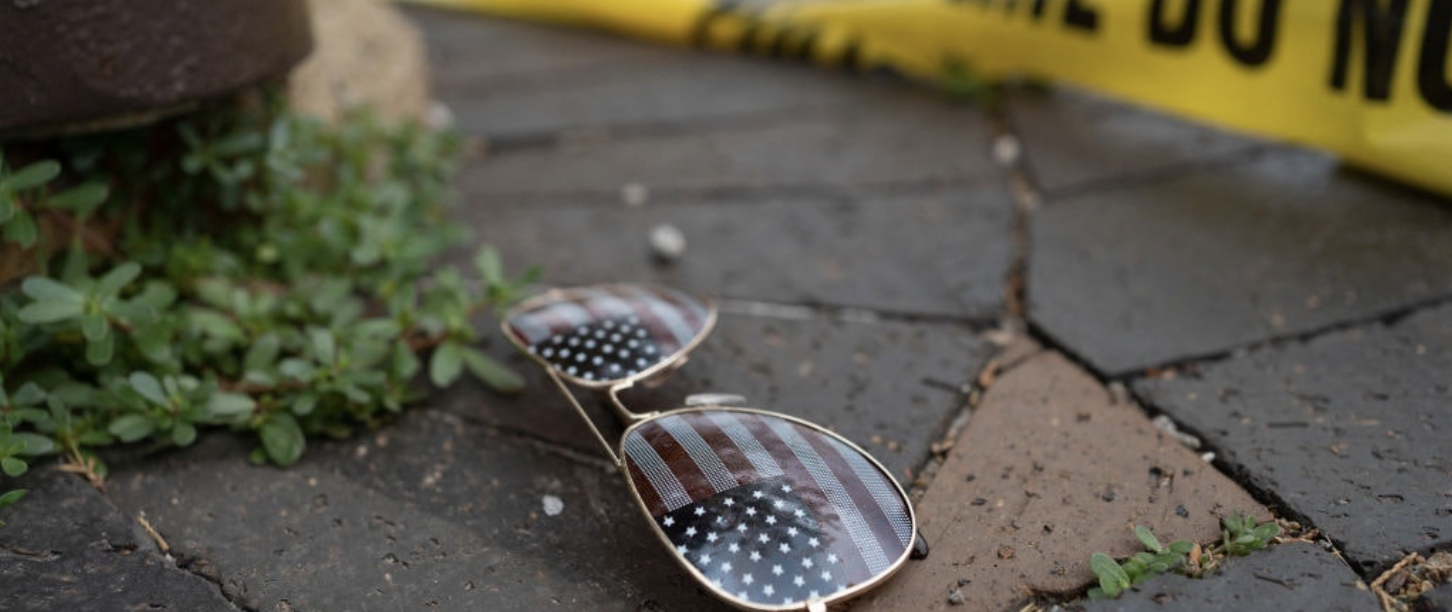 US-Flag-on-mirrored-sunglasses-crime-scene-tape