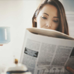 Woman reading newspaper