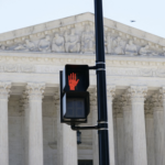 crosswalk in front of SCOTUS flashes STOP