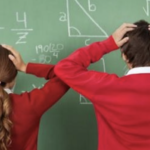 confused students at a chalkboard with math equations