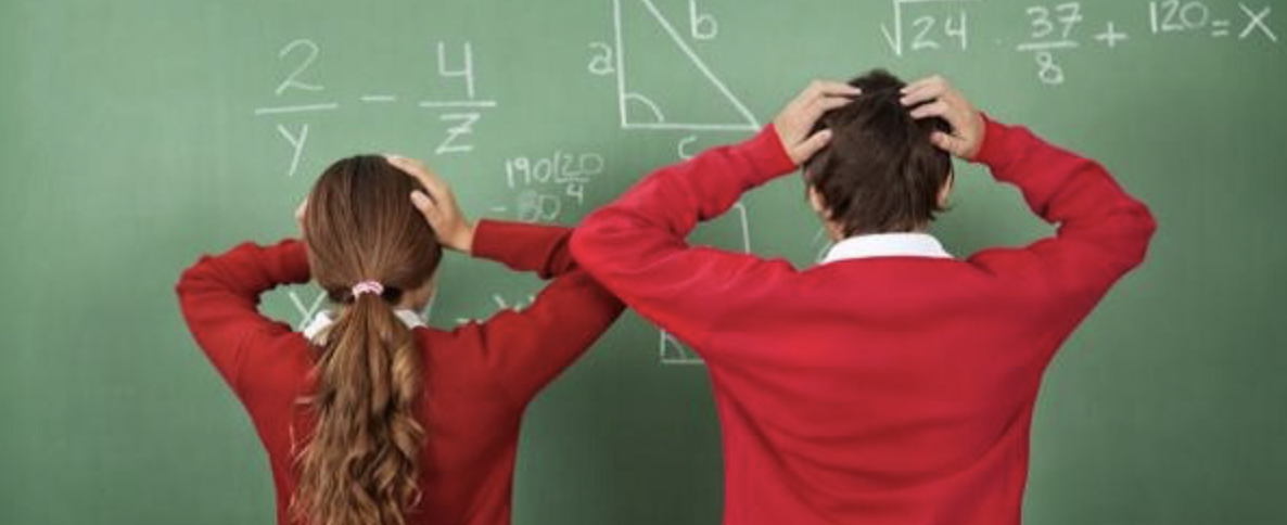 confused students at a chalkboard with math equations