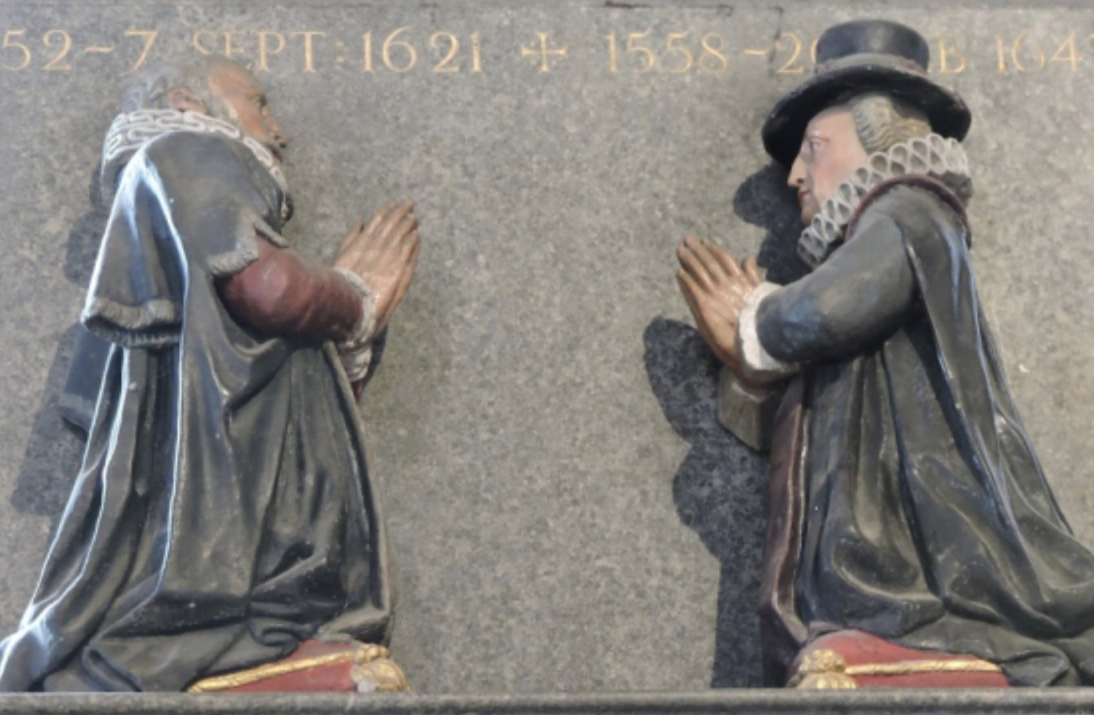 2 colonial men praying stone