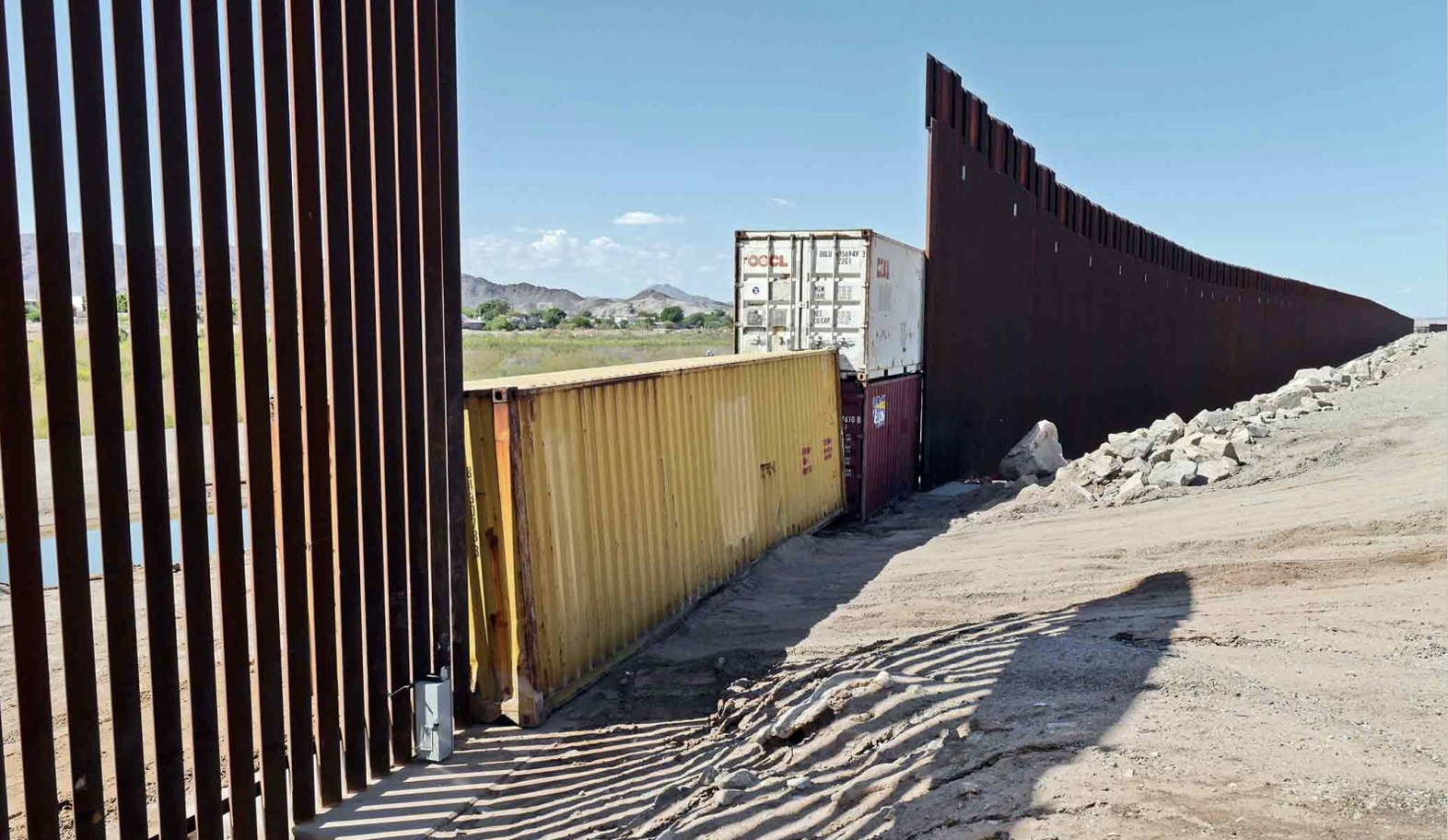 Shipping containers block a void in gap at border San Luis, AZ, 08-19-22