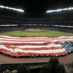 US Flag spread out on Baseball Outfield
