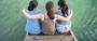 Woman comforts two others