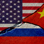 US China Russia painted flags on broken stone.png