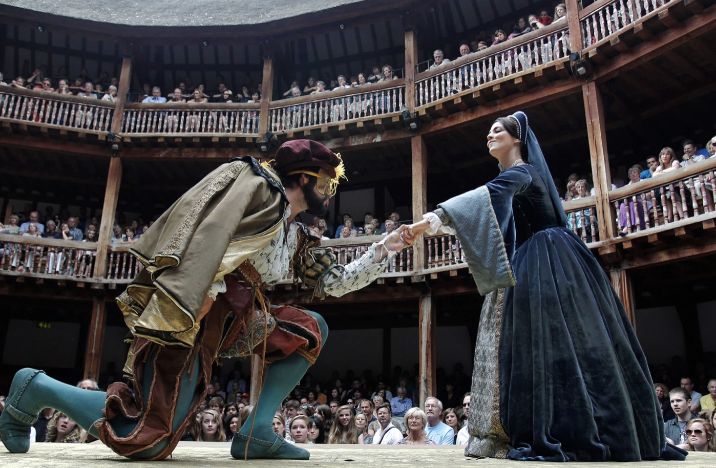 Actors perform a scene from William Shakepeare's Henry VIII at Globe Theatre, London