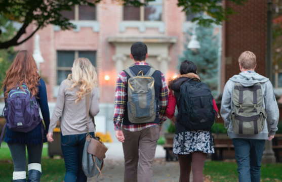 Students w backpacks walk into school