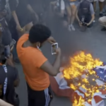 protesters burning the US Flag