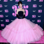 Dylan Mulvaney in a bright pink ballgown