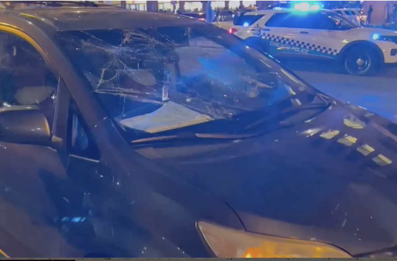 smashed windshield after teen riot in Chicago