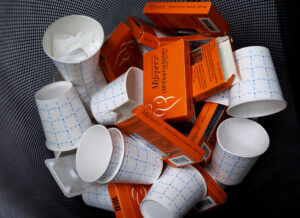 Used boxes of Mifepristone pills fill a trash can