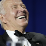 Biden head thrown back laughing