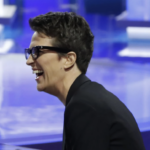 Rachel Maddow profile laughing