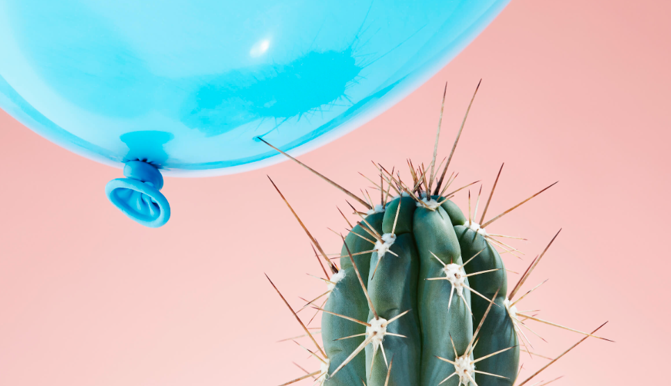cactus spine pokes blue balloon