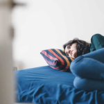 depressed white woman on a bed