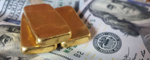 Gold bars and $100 bills