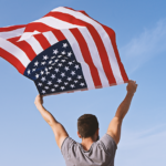 Man Holding Waving American Flag