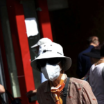 Woman in Queens, NY wearing a KN95 mask