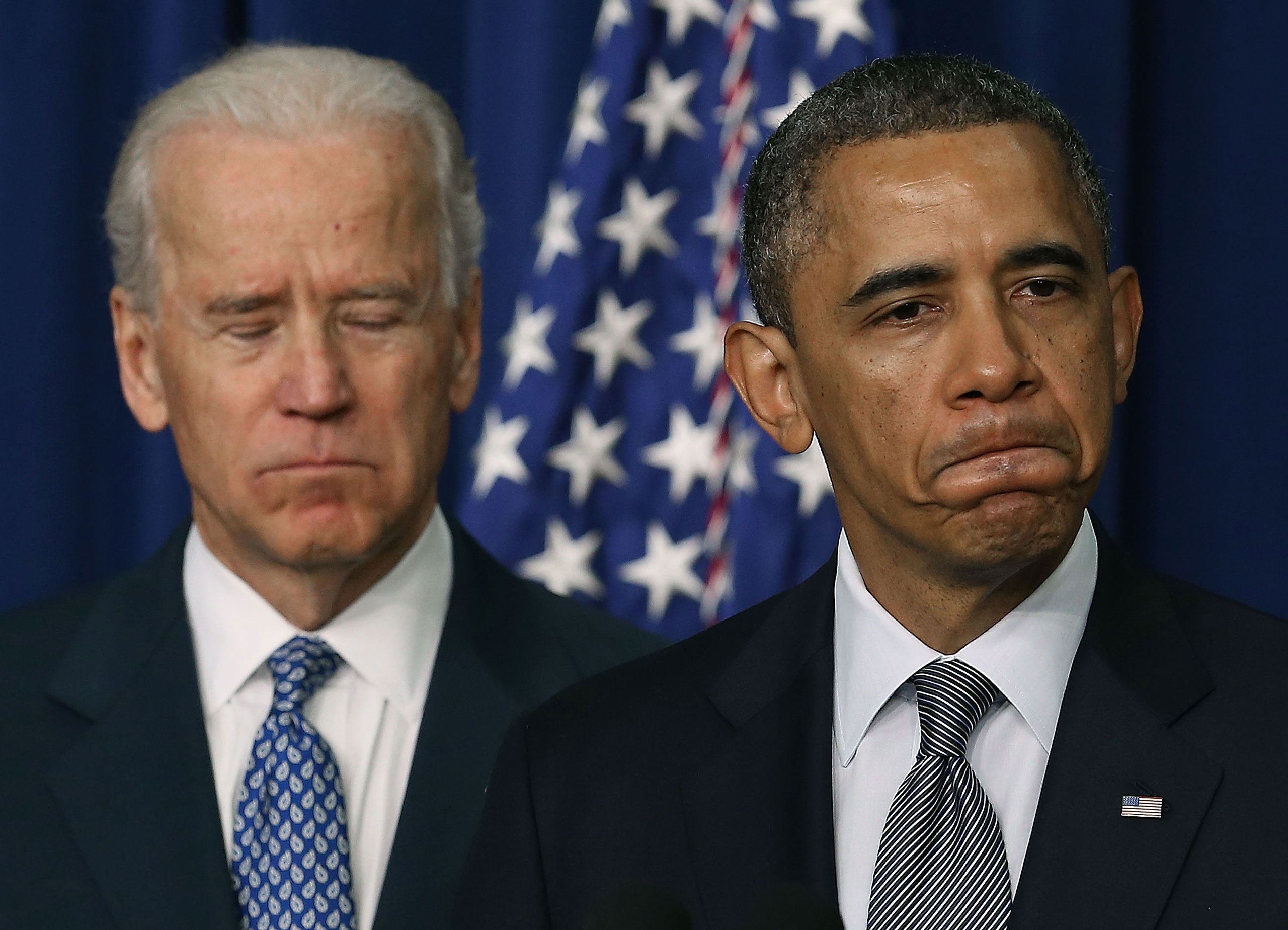 Obama and Biden frowning