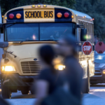 school bus early AM - students walking in front