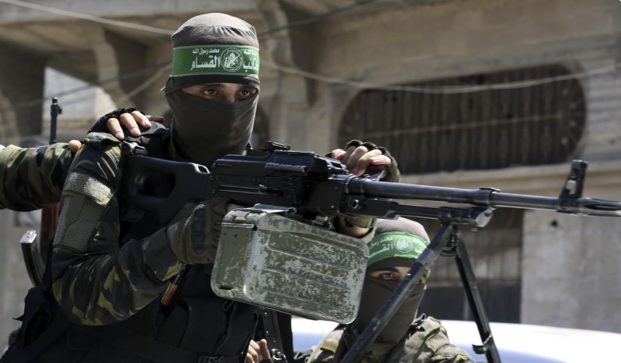 Hamas soldier holding automatic mounted gun