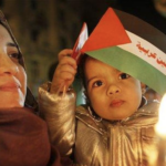 Palestinian woman infant son candle light